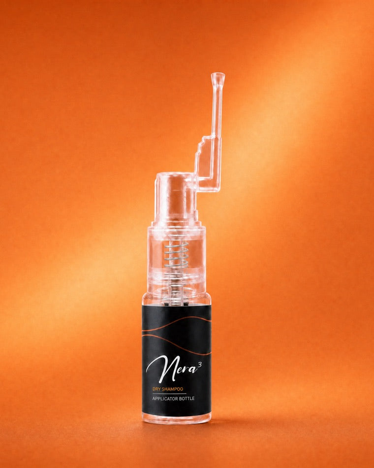 Nera3 Dry Shampoo applicator bottle on an orange field