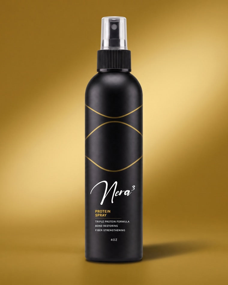 Nera3 Protein Treatment, matte-black spray bottle on a gold field